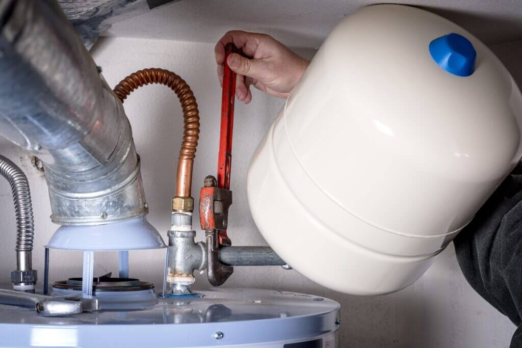 a technician working on a water heater Belleville MI