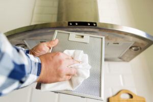 a person cleaning a fan filter Belleville MI