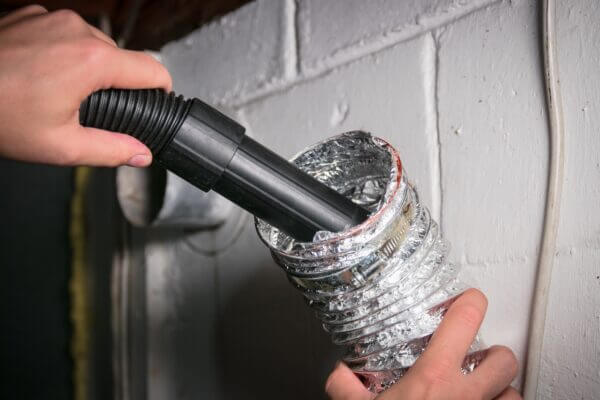 a person cleaning a dryer vent Belleville MI