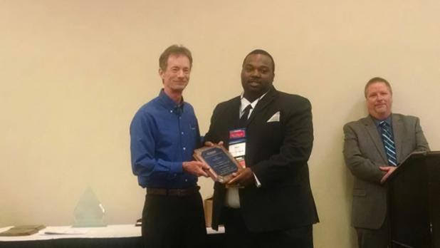 Brynn Cooksey receiving the Imperial Award for excellence
